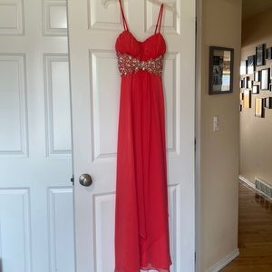 Formal dress. Never worn. Size is 1/2. Beautiful salmon color